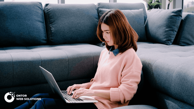 Our Blog 17 woman sitting on sofa relaxing while browsing onli 5NY9LSV 1
